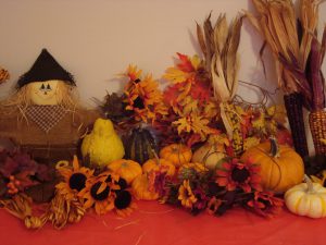 Favorite Fall Things: pumpkins, scarecrow, leaves, flowers, and multi-colored corn