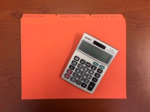 Picture of calculator and file folders