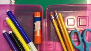 picture of pencil box with school supplies