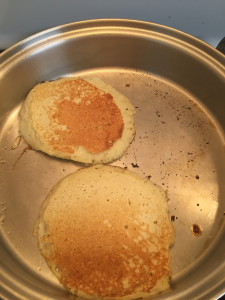 photo of pancakes cooking in a pan