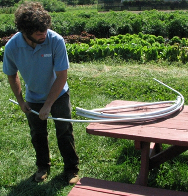 A hoop bender being used to fashion a hoop from a length of electrical conduit. Photo credit – Johnny’s Seeds