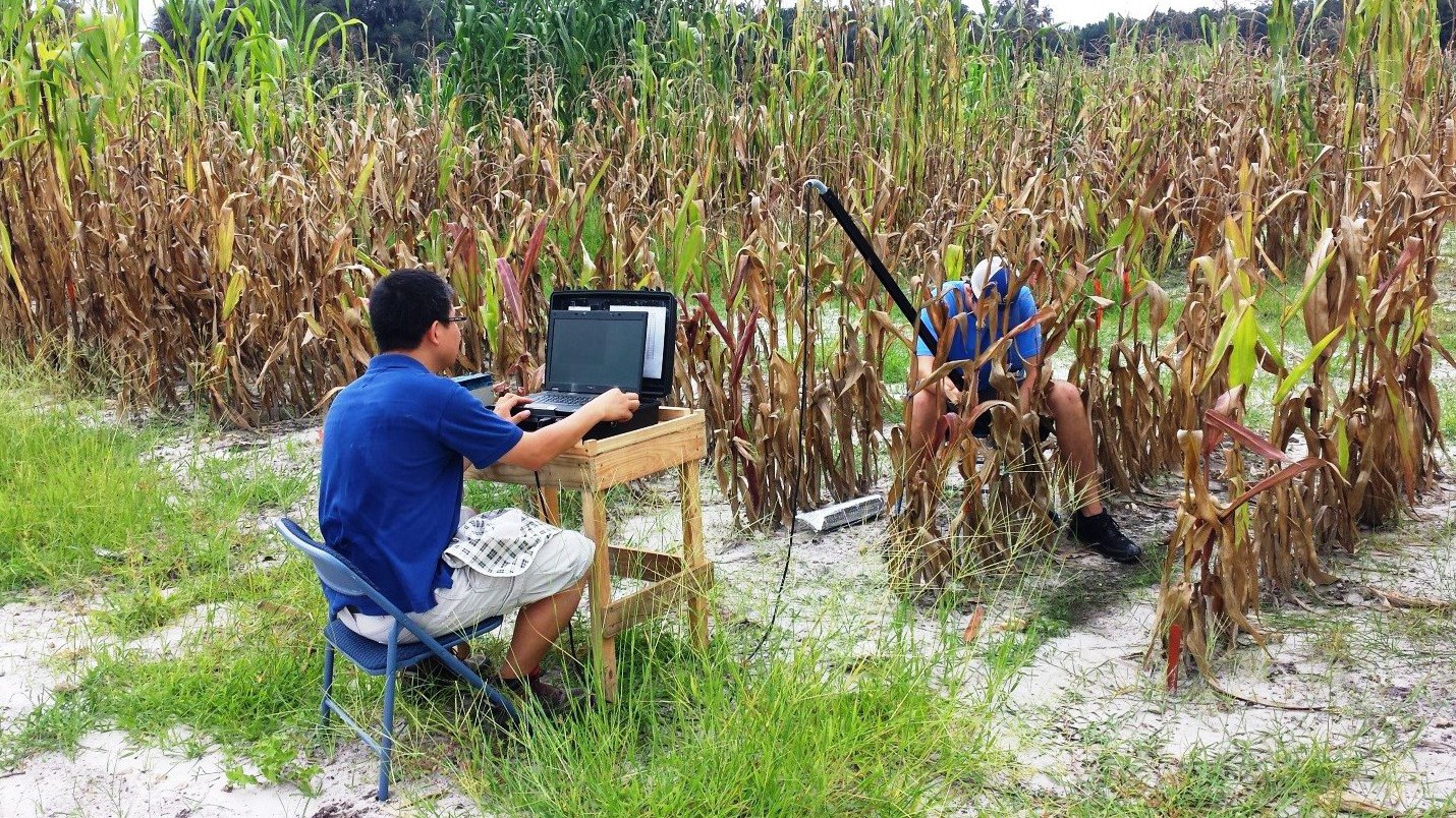 Figure 2. Root image is being captured; Dr. Na is monitoring captured images (left), Mr. Carter Lambert, a UF student, is inserting camera in to the tube accordingly (right).