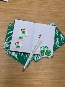 4-H stickers, pencils, bandanas, and a notepad