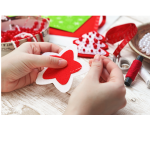 hands making holiday crafts