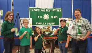 Poultry Club members show off their ribbons. 