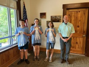 Photo of youth holding third place ribbons for their team, intermediate win at the 2025 Florida 4-H Forest Ecology Contest.