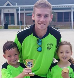 Family wearing green and black shirts