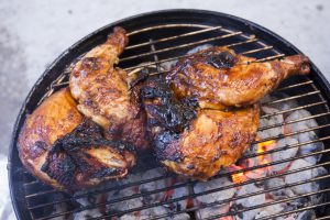 chicken cooking on a grill