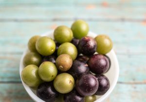 Muscadine grapes come in a variety of colors, including deep purple, black, bronze, and green, each offering its unique flavor profile and appeal. Photo by Tanya, Adobe Stock.