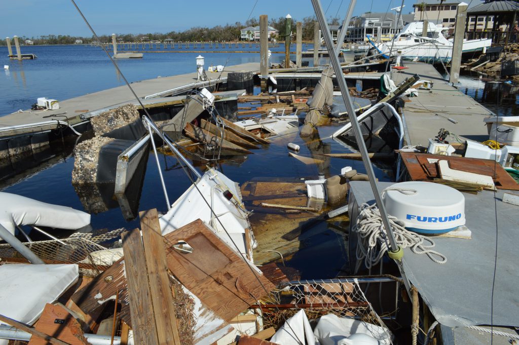 Damage to marina docks and vessels after Hurricane Michael.