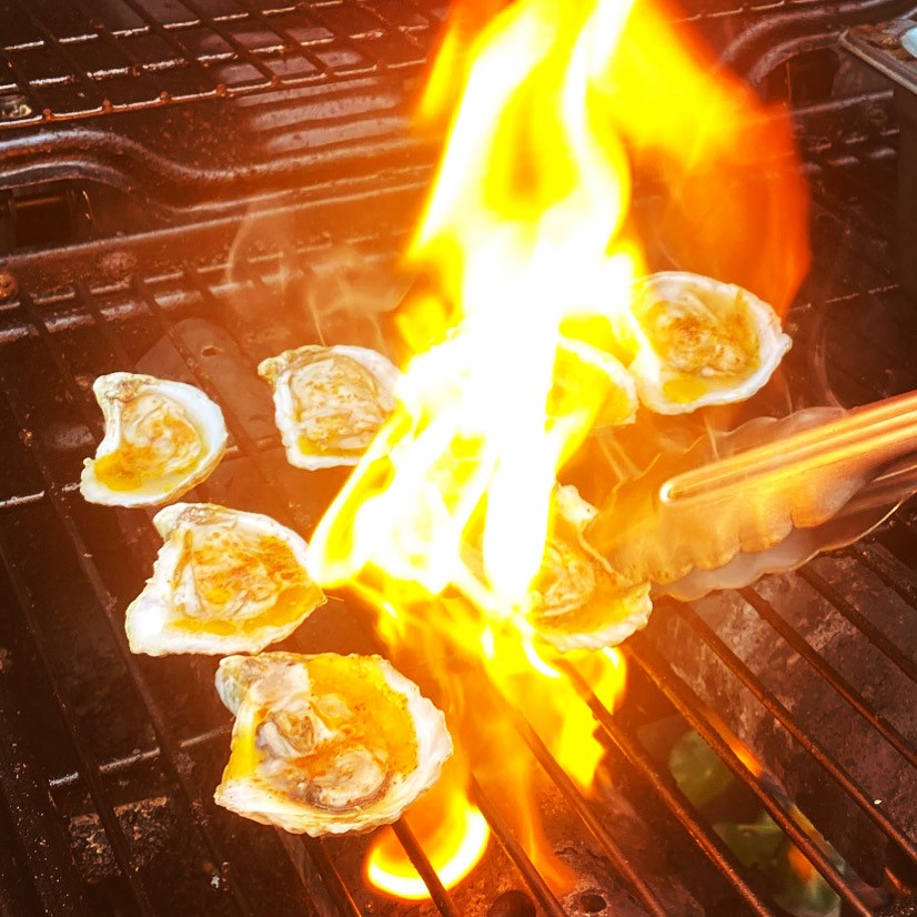 Chargrilled oysters kissed with flame