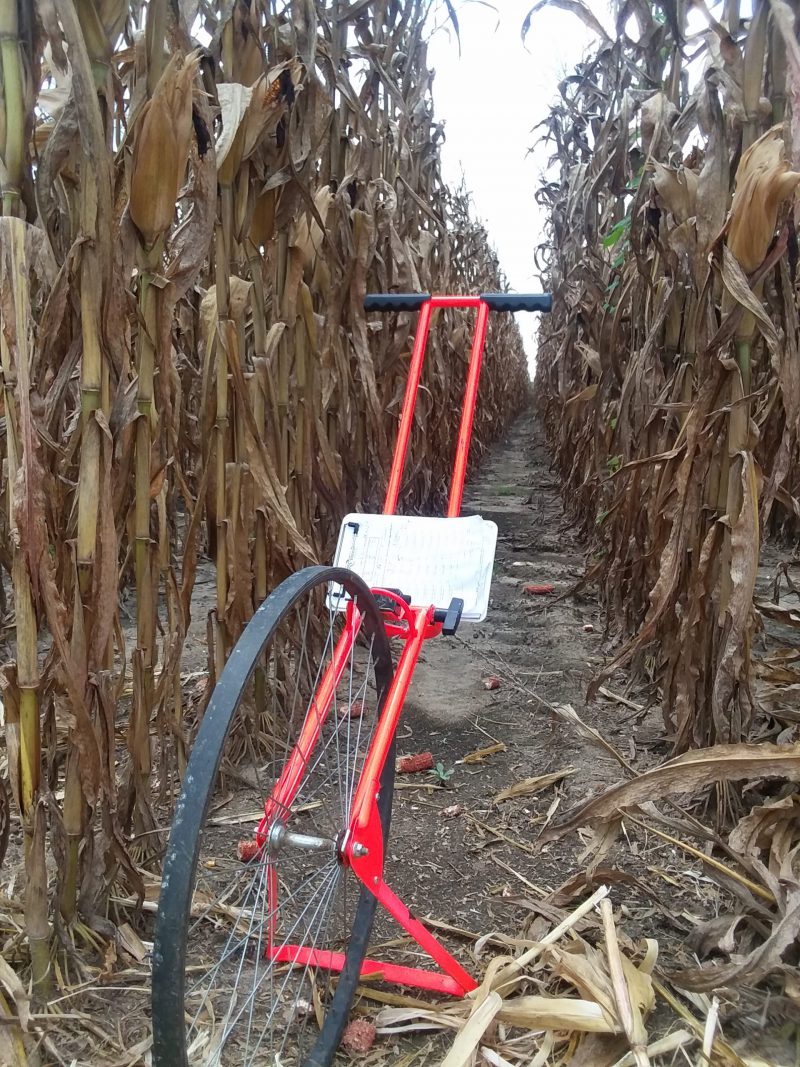Measuring wheel and clipboard for performing yield checks