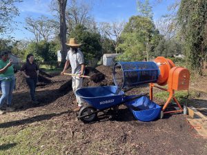 Sundiata Ameh-El, of Compost Community, shows attendees his composting process during the Compost and Soil Management CRAFT workshop. Photo by Red Hills Small Farm Alliance.